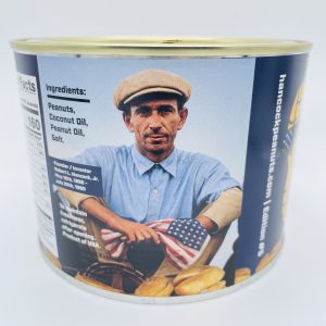 A tin of Salted Cocktail Peanuts | America's 250th by Hancock Peanut Company4, featuring a vintage label with a man in a flat cap and blue shirt holding an American flag. Ingredients: peanuts, coconut oil, peanut oil, salt.