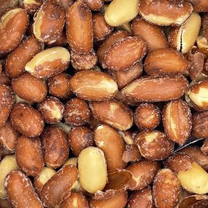 A close-up photo of Red Skin Peanuts from Hancock Peanut Company, featuring salted, roasted peanuts with brown textured skins and a few lighter, skinless ones mixed in.