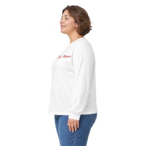 A woman in profile wearing a white long-sleeve shirt with red text and blue jeans, shown in 5572082662138896062_2048.jpeg.